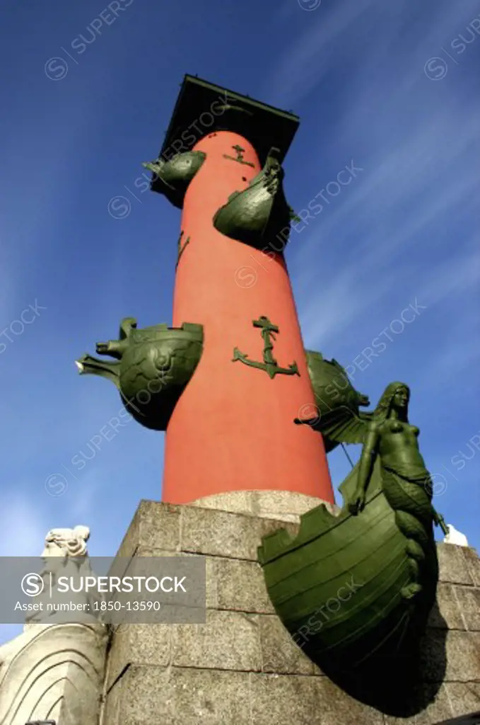 Russia, St Petersburg, Angled View Of Rostral Column With Anchor Motif And Figureheads On Boat Bows