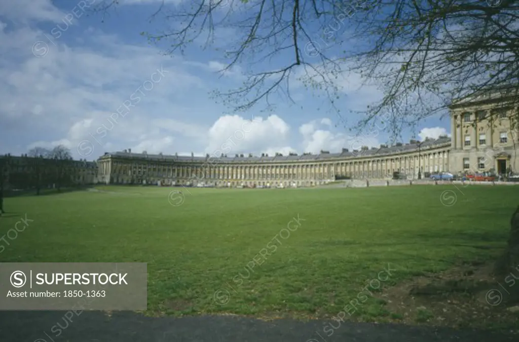 England, Avon , Bath, 'The Royal Crescent Across Grass Area, Budding Branches Frame '