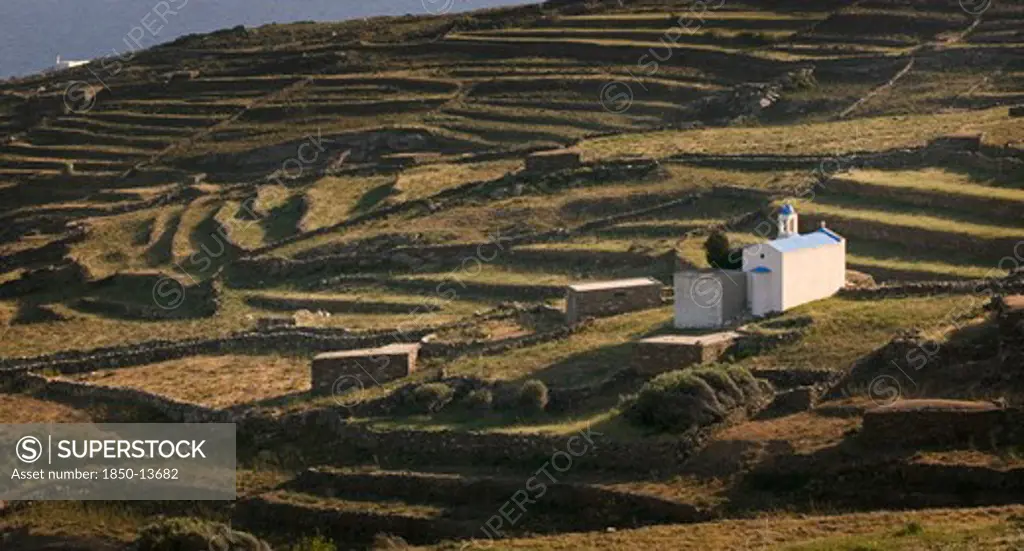 Greece, Cyclades, Tinos, Religious Shrine On A Terraced Hill Side.