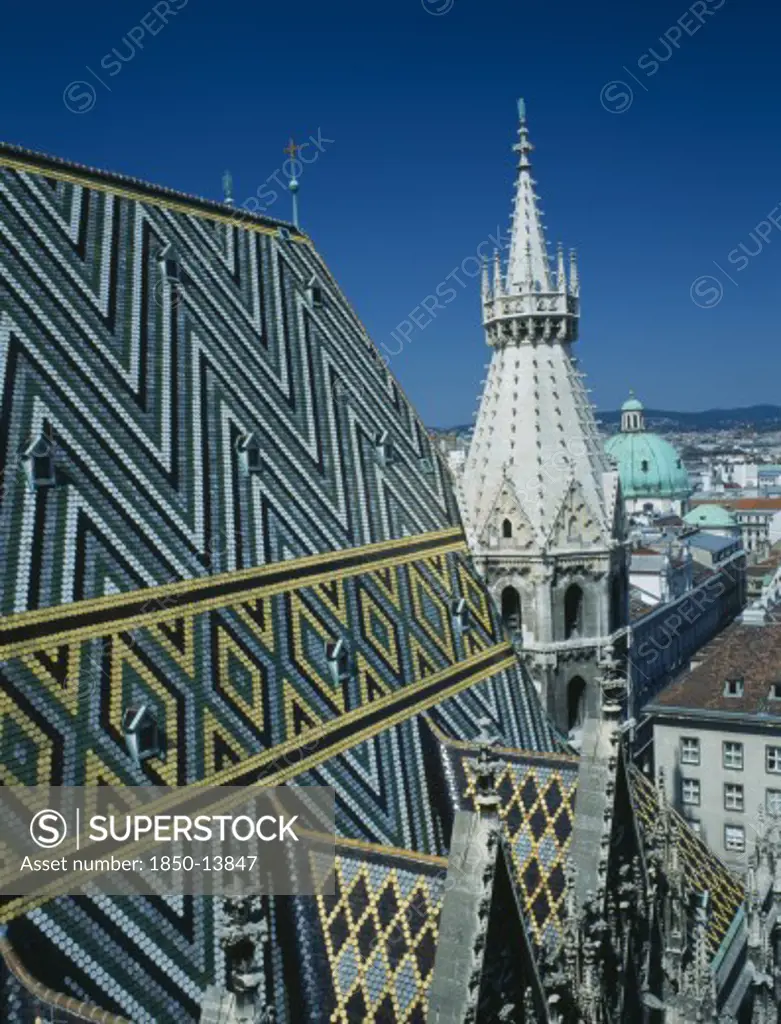 Austria, Vienna, St Stephens Cathedral Aka Stephensdom With Patterned Roof Tiles And Spire Seen From The North Tower