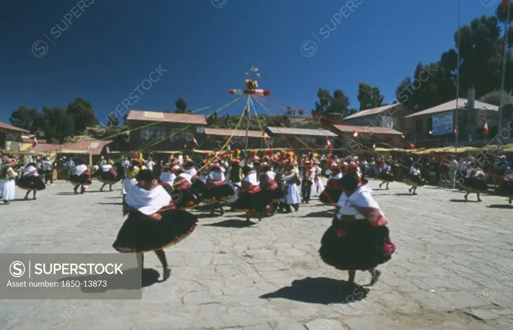 Peru, Puno, Lake Titicaca, Taquile Island. Dancers In Local Costume Take Part In Island Festival