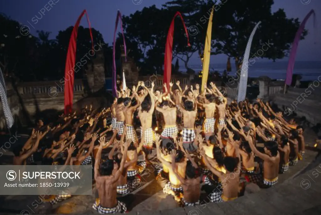 Indonesia, Bali, Kechak Dancers Forming Human Mandala.  The Kechak Dance Tells The Story Of Prince Rama And His Quest To Rescue His Wife Sita From The Demon King Ravana.