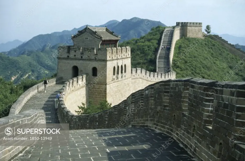 China, Badaling, The Great Wall.  Few Tourists On Stretch Of Wall With Gatehouse.