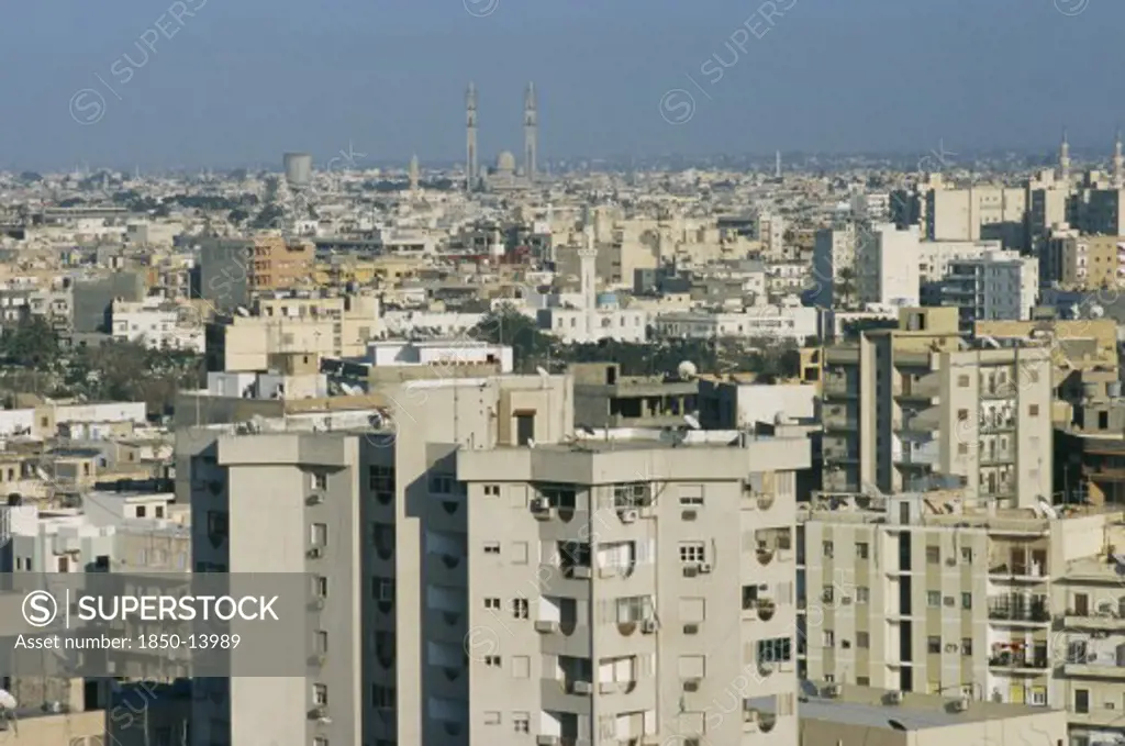Libya, Tripoli, Cityscape View Over Housing And Urban Architecture Toward Distant Mosque