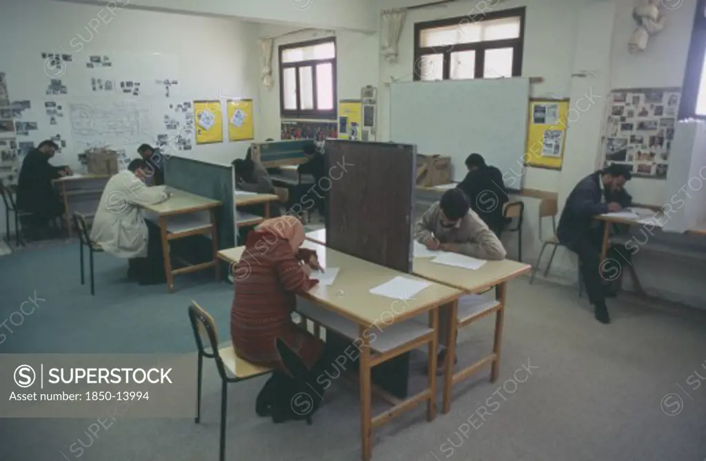 Libya, Benghazi, Students Sitting An English Exam. All Male And One Female.