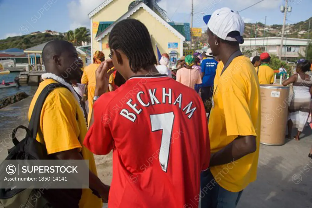 West Indies, St Vincent & The Grenadines, Union Island, Men Of The Baptist Congregation In Clifton At Easter Morning Harbourside Service For Those Lost At Sea With One Wearing A Beckham Football Shirt