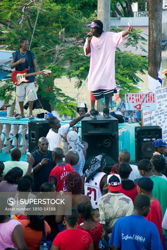 West Indies, St Vincent & The Grenadines, Union Island, Singer And Guitarist With Sound System At Easterval Easter Carnival In Clifton