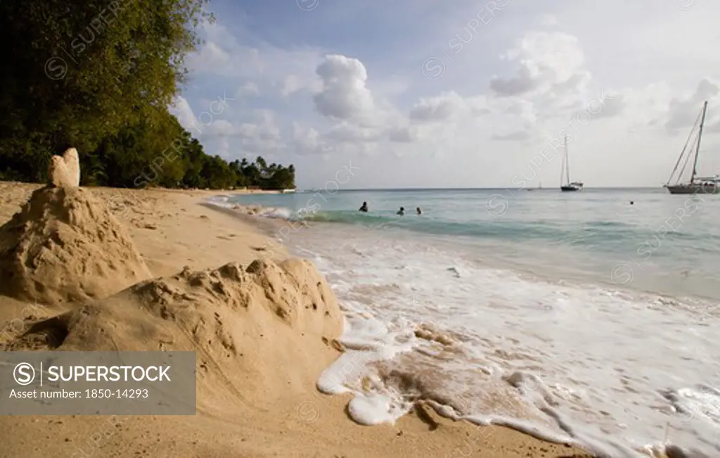 West Indies, Barbados, St Peter, Gibbes Bay Beach In The Late Afternoon With Sandcastles At The Waters Edge