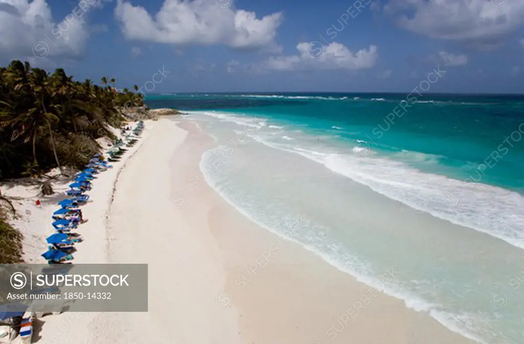 West Indies, Barbados, St Philip, Crane Beach With Sunbeds And Umbrellas On The Beach Edge