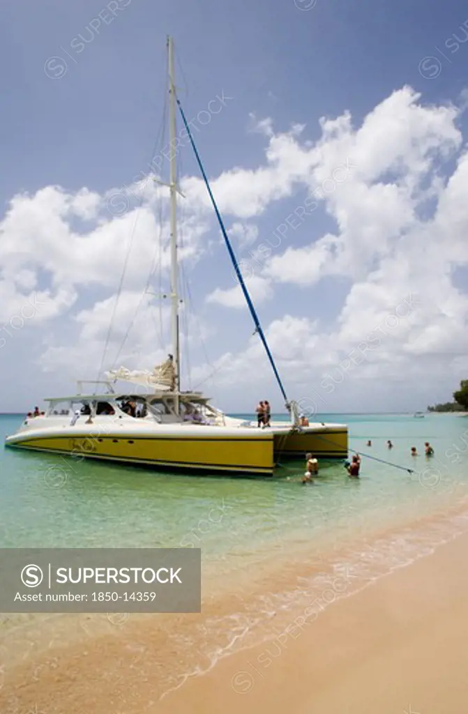 West Indies, Barbados, St Peter, Catamaran With Tourists Moored On Gibbes Beach