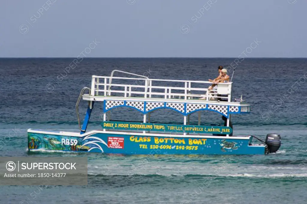 West Indies, Barbados, St James, Tourists On Glass Bottom Boat Off The Beach At Holetown
