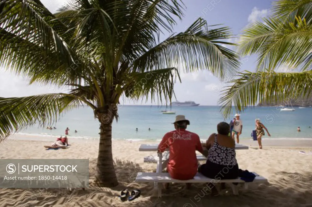 West Indies, St Vincent & The Grenadines, Bequia, Tourists On Beach At Lower Bay With Cruise Ship Offshore