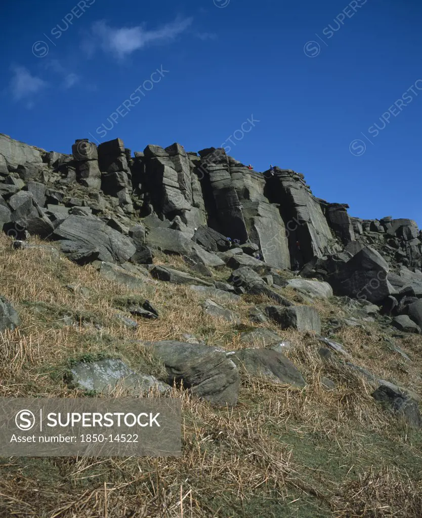 England, Derbyshire, Stanage Edge, Gritstone Craggs With Rock Climbers.