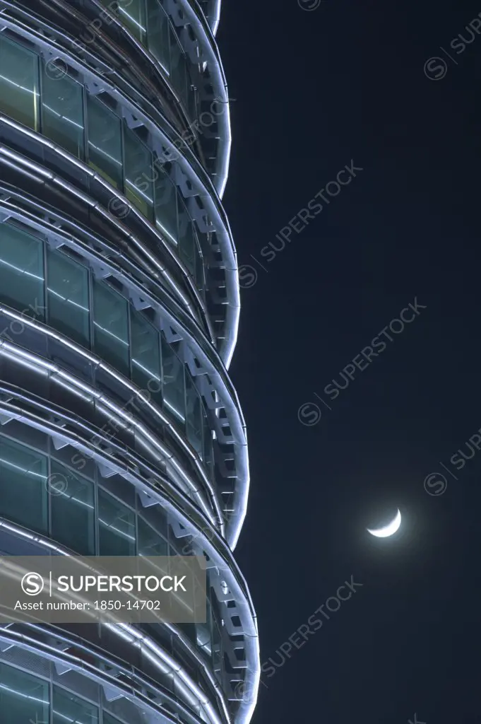 Malaysia, Peninsular, Kuala Lumpur, Detail Of The Petronis Towers At Night With A Crescent Moon Behind.