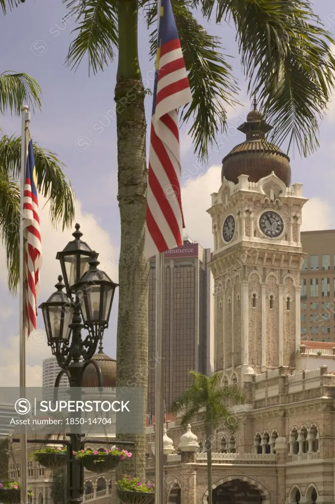 Malaysia, Peninsular, Kuala Lumpur, 'The Sultan Abdul Samad Building With Palm Tree, Flag And Lamp Post In The Foreground. '