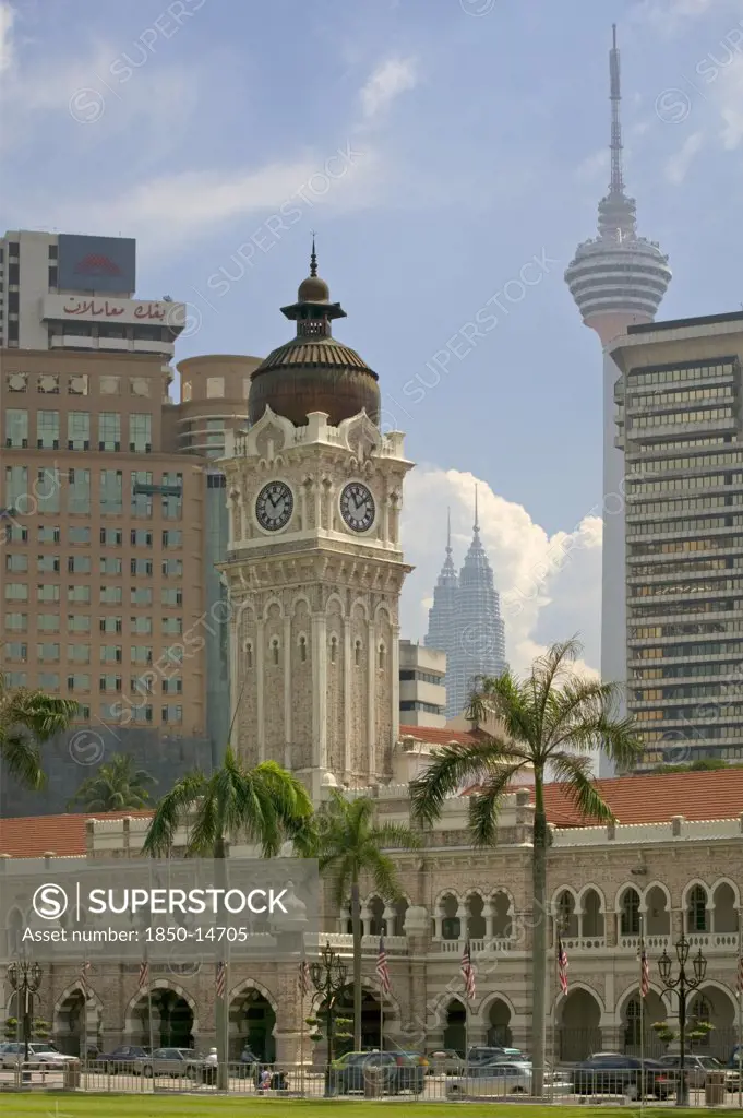Malaysia, Peninsular, Kuala Lumpur,  View Of The Sultan Abdul Samad Building From Merdeka Square With Kl Tower And The Petronis Towers Behind.
