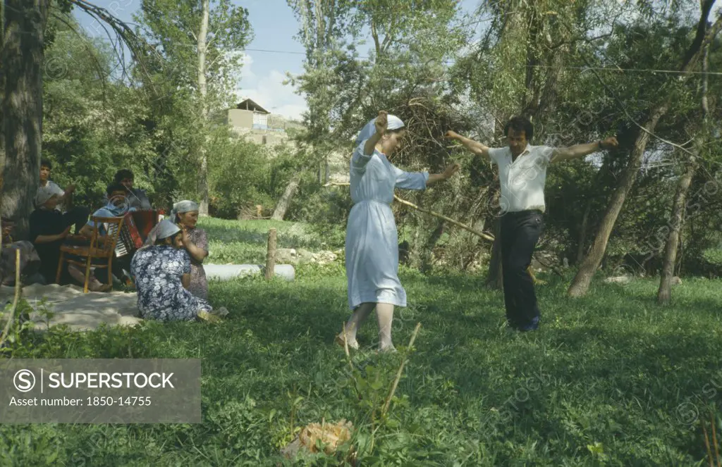 Russia, Dagestan, Rahata Village, Chechen Man And Avar Girl Dancing.