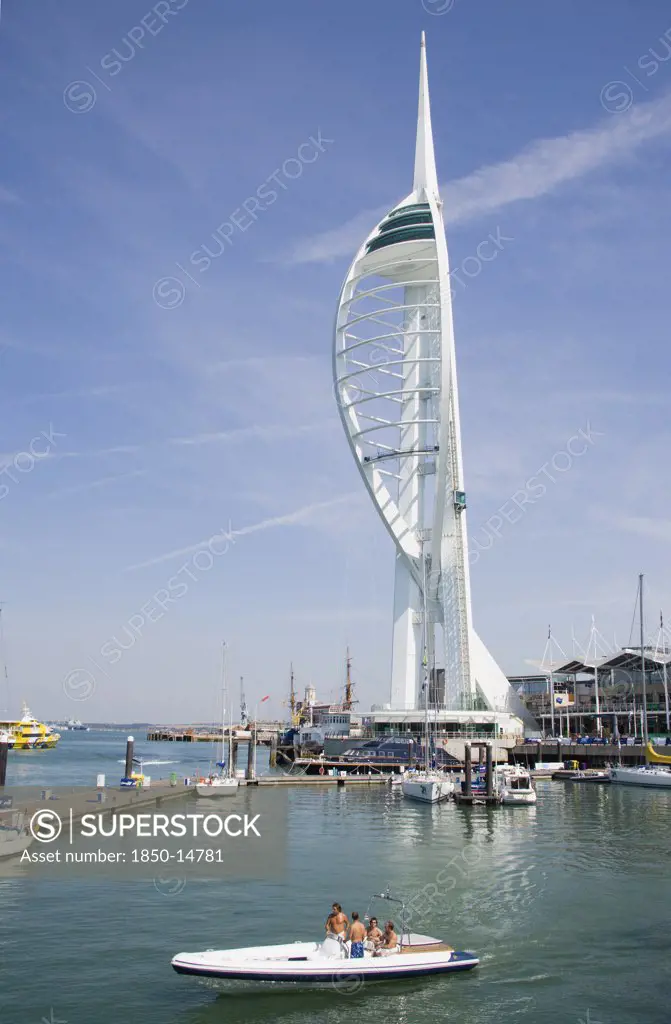 England, Hampshire, Portsmouth, The Spinnaker Tower The Tallest Public Viewing Platforn In The Uk At 170 Metres On Gunwharf Quay With Speedboat Leaving Moorings