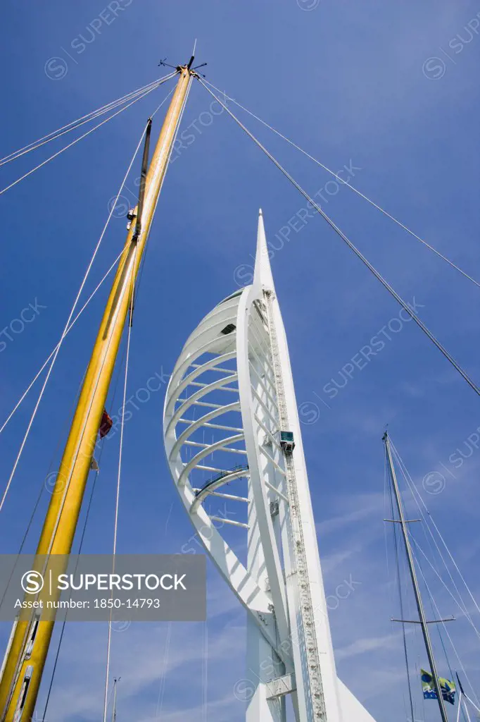 England, Hampshire, Portsmouth, The Spinnaker Tower The Tallest Public Viewing Platforn In The Uk At 170 Metres On Gunwharf Quay With A Yachts Mast In The Foreground
