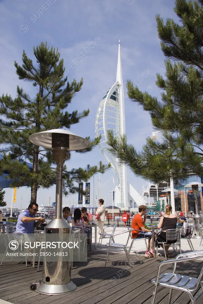 England, Hampshire, Portsmouth, The Spinnaker Tower The Tallest Public Viewing Platforn In The Uk At 170 Metres On Gunwharf Quay With Outdoor Restaurant Seating In The Foreground