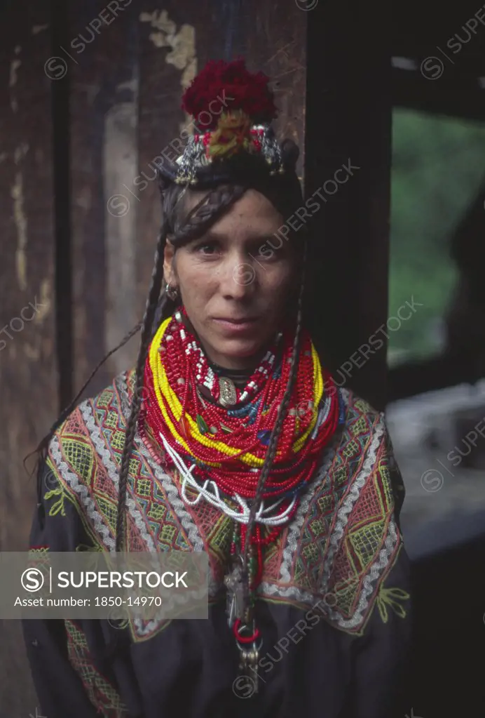 Pakistan, North West Frontier Province, Rumbur Valley, Kalash Woman Wearing Traditional Dress.