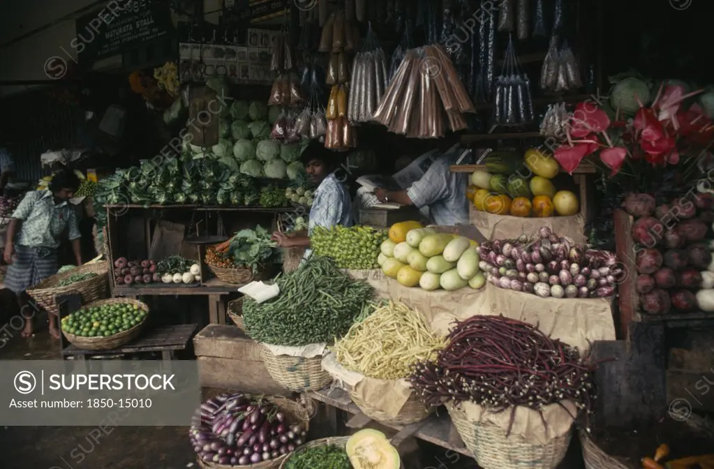 Sri Lanka, Kandy, 'Vendors And Open Fronted Stall With Display Of Flowers, Vegetables And Spices.'