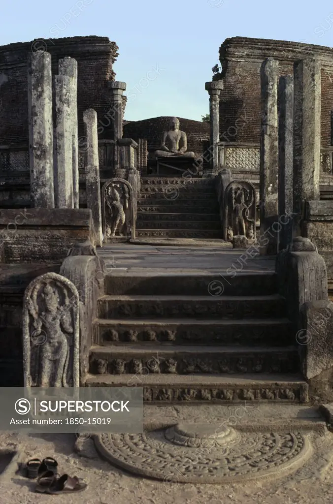 Sri Lanka, Polonnaruwa, Vatadage Circular Relic House.  Moonstone Or Carved Stone Doorstep At The Northern Entrance With Seated Buddha Figure Beyond.