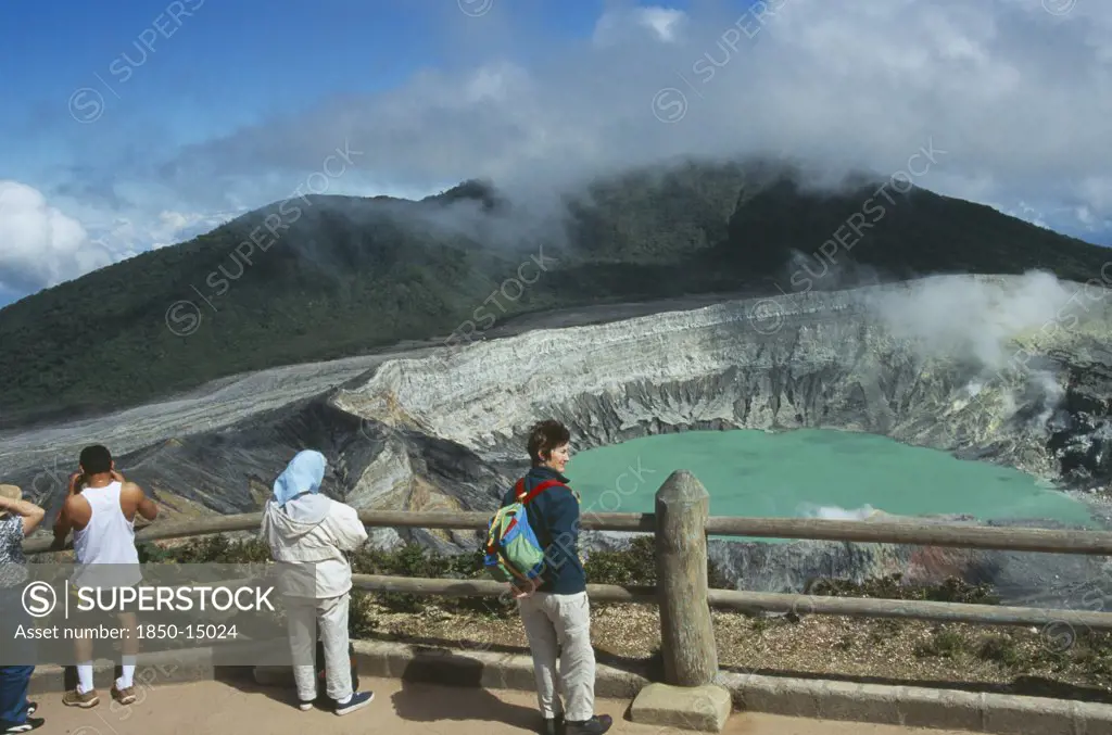 Costa Rica, Alajuela Province, Poas Volcano, Volcan Poas National Park. View From The Observation Platform With Tourists Looking Over Crater.