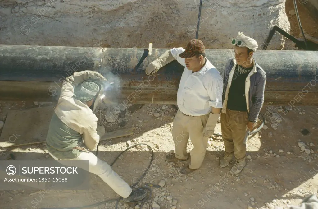 Libya, Work, Oil Workers Welding Pipe.