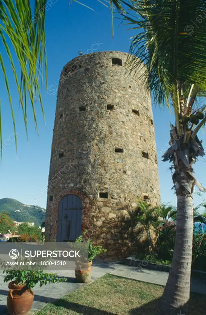 West Indies, Us Virgin Islands, St Thomas, Blackbeards Castle A Small Tower With Blue Door Set On Hillside