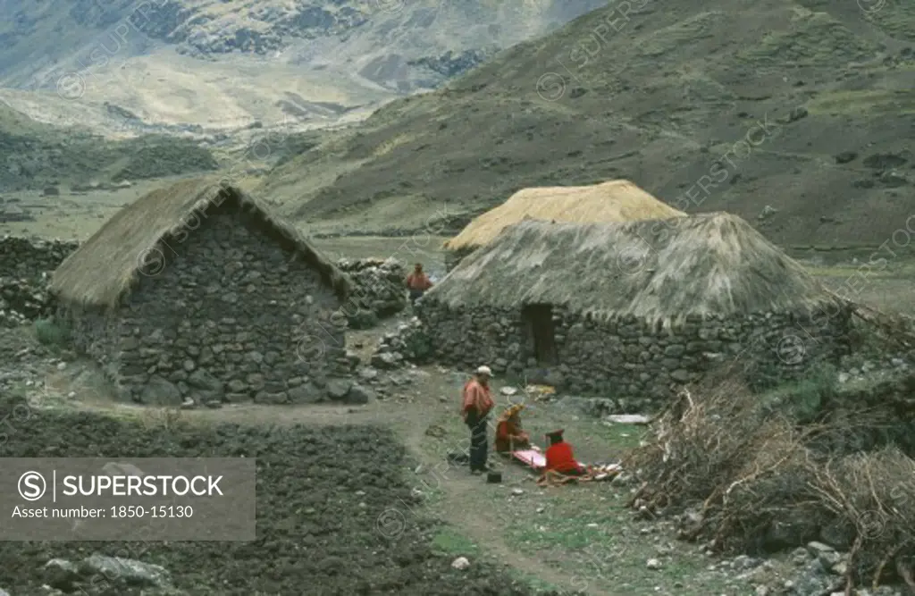Peru, Cusco, Cancha Cancha, Local Quechuan People Weaving In Front Of Dwelling.