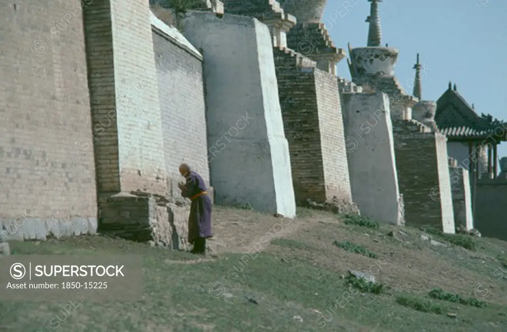 Mongolia, Central Gobi Province, Karakorum, Pilgrim Circumnavigating City Walls On Site Of Ancient Capital Of Ghengis Khan.
