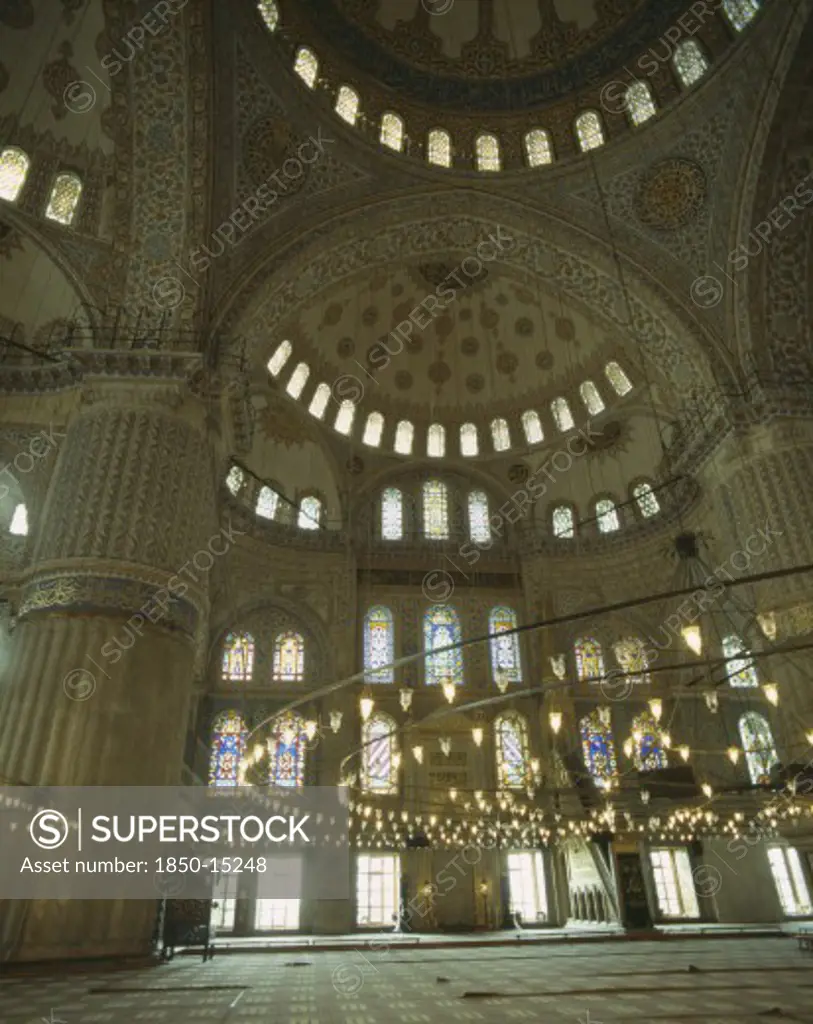 Turkey, Istanbul, 'Interior Of Blue Mosque Of Sultan Ahmet. Dome Roof, Stained Glass Windows And Large Chandelier'