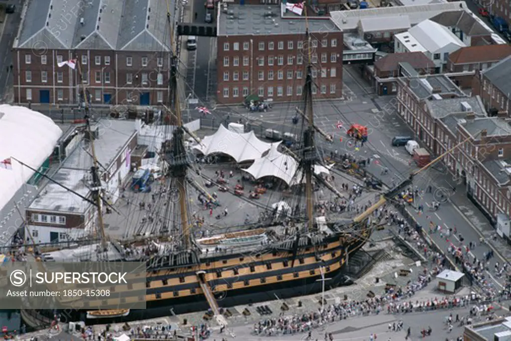 England, Hampshire, Portsmouth, Hms Victory. Arial View Of Royal Naval Dockyard. People Crowding Round.