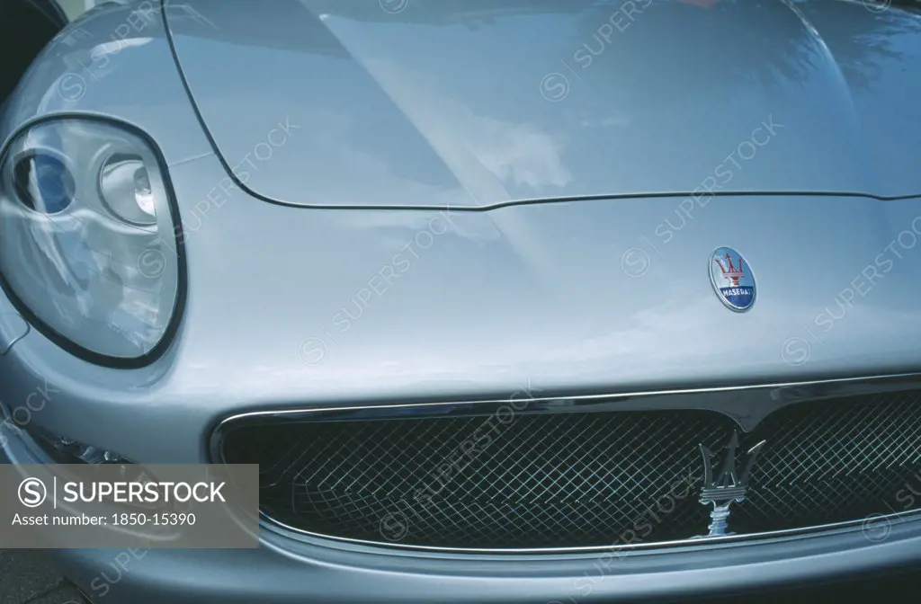 Transport, Road, Cars, Detail Of Silver Maserati With Emblem And Front Light.