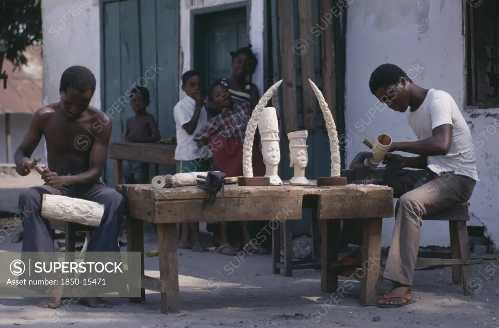 Congo, Crafts, Men Carving Ivory With Watching Children.