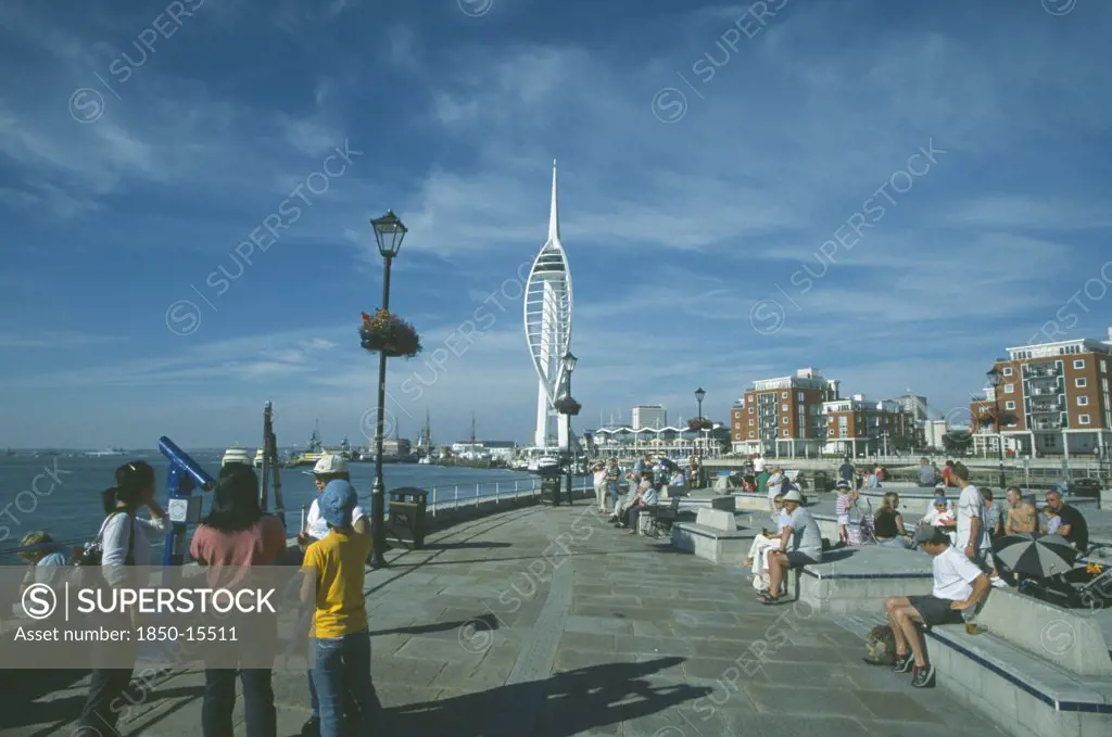 England, Hampshire, Portsmouth, Spice Island. Groups Of People Looking Towards The Spinnaker Tower.