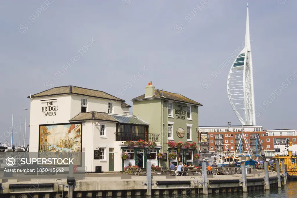 England, Hampshire, Portsmouth, The Camber In Old Portsmouth Showing The Spinnaker Tower Behind The Bridge Tavern With Its Mural Of Thomas Rowlansons Cartoon Titled Portsmouth Point.
