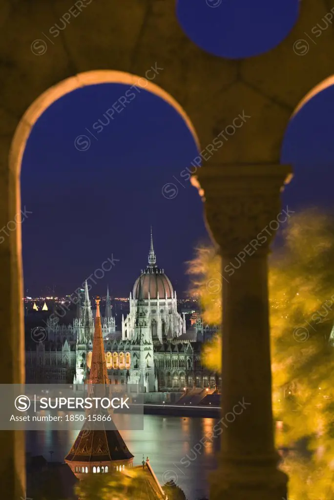Hungary, Budapest, 'Night Time View Of Parliament Over The Danube From Fishermen'S Bastion, Viewed Through Arches.'
