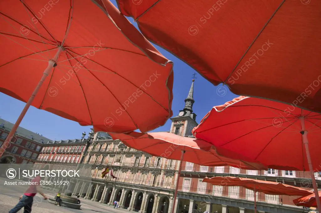 Spain, Madrid, 'Red Restaurant Parasols In Plaza Mayor, Main Square.'
