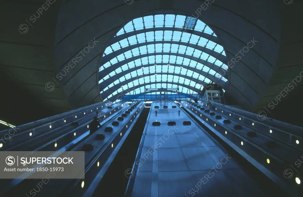 England, London, Canary Wharf Underground Station Escalators And Glass Roof.