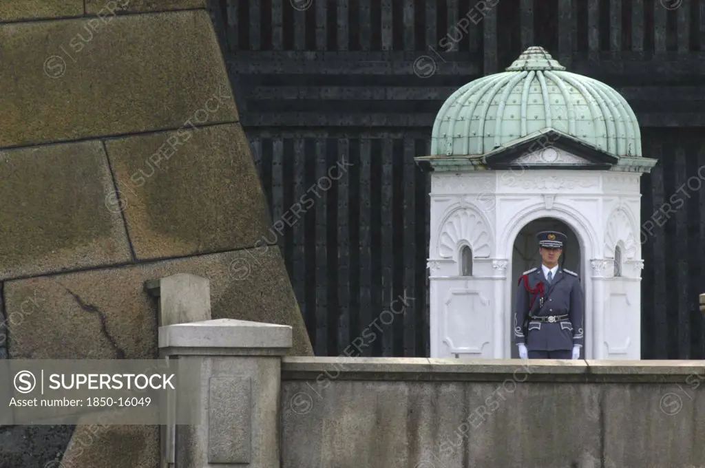 Japan, Honshu,  Tokyo, A Guard On Duty At The Niju Bashi Bridge Of The Imperial Palace