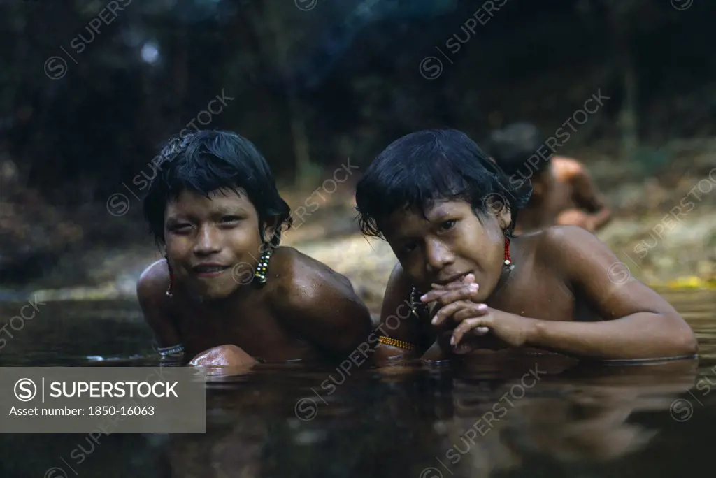 Brazil, Serra Dos Pacaas Novas, Children In The Water With Beaded Body Decorations