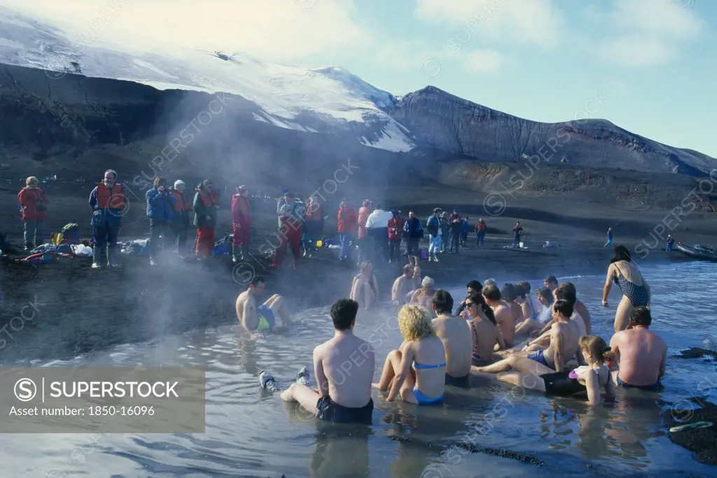 Antarctica, Antarctic Peninsula, Deception Island, Tourists Bathing In Hot Springs At Pendulum Cove.
