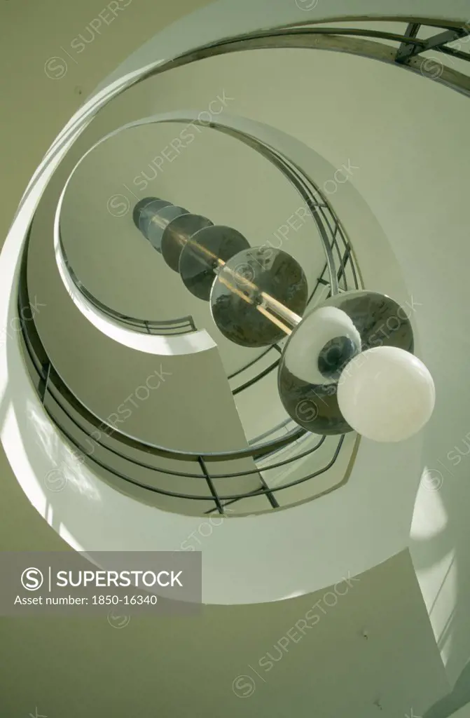 England, East Sussex, Bexhill On Sea, De La Warr Pavilion. Interior View Looking Upwards At The Helix Like Spiral Staircase And Bauhaus Globe Lamps.