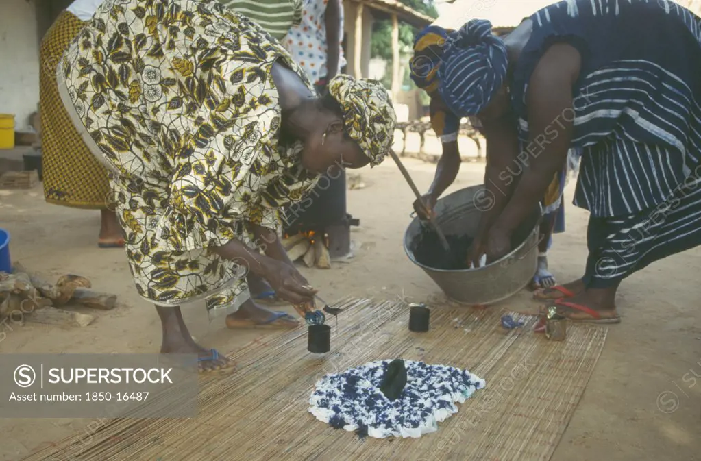 Gambia, People, Women Working Together To Produce Indigo Tie Dye Fabric.