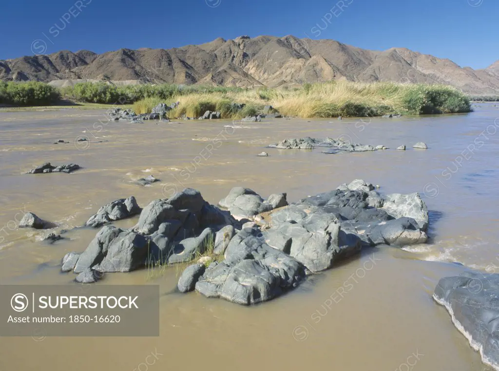 Namibia, South, Orange River, Rocks In The  Water In The Orange River Further West After Being Joined By The Fish River.