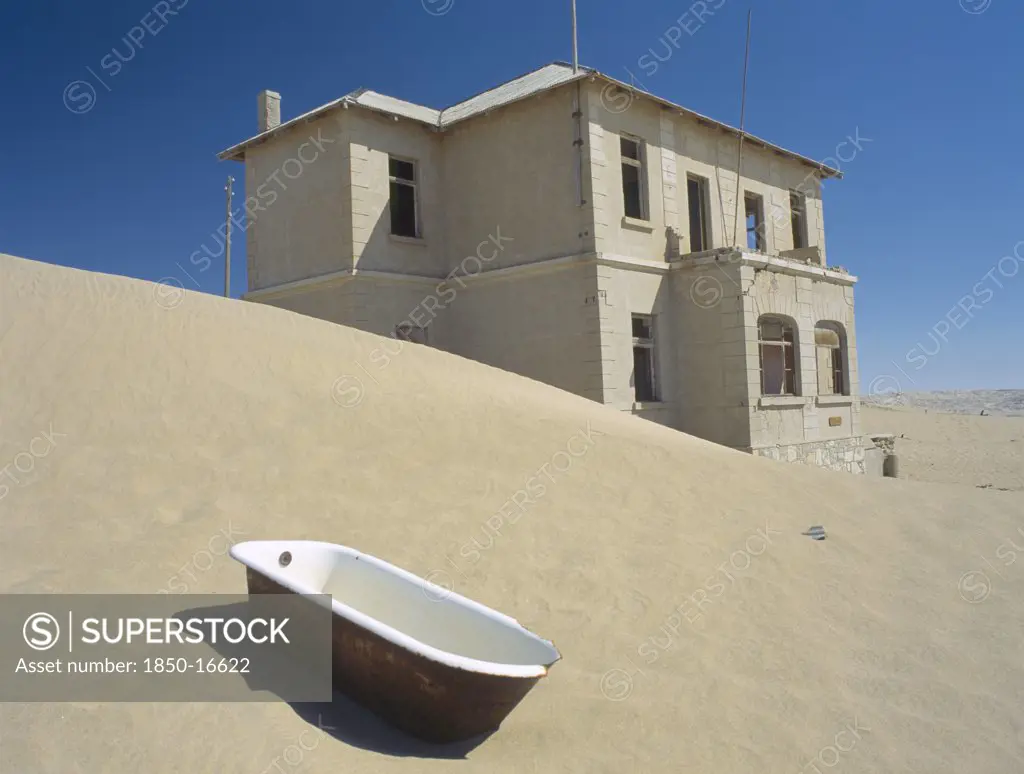 Namibia, Kolmanskop, A House With A Bath Tub In The Foreground  With Desert Sands Encroaching.