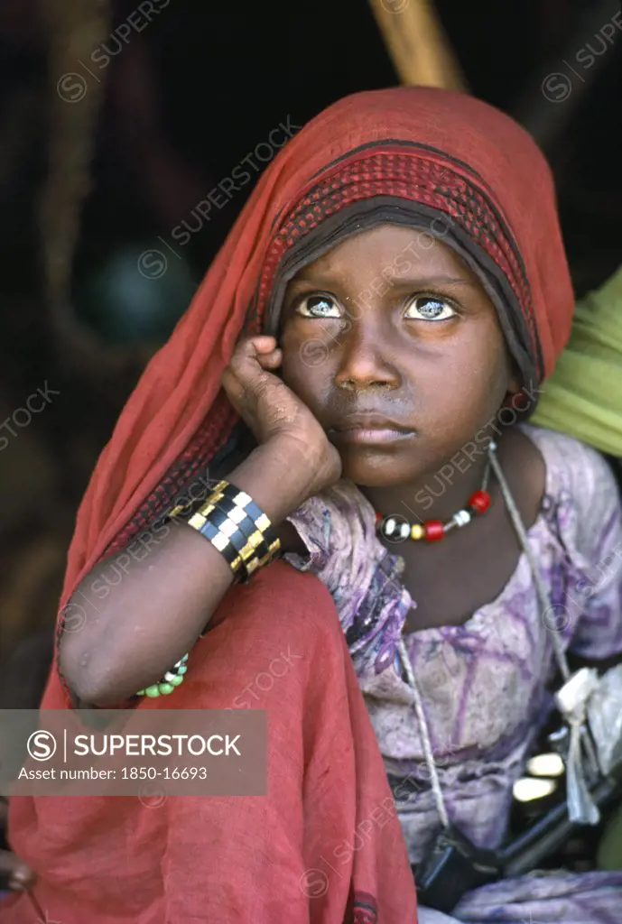 Sudan, North East, Gadem Gafriet Camp, Portrait Of Beni Amer Beja Nomad Refugee Girl With Chin Resting On Hand.
