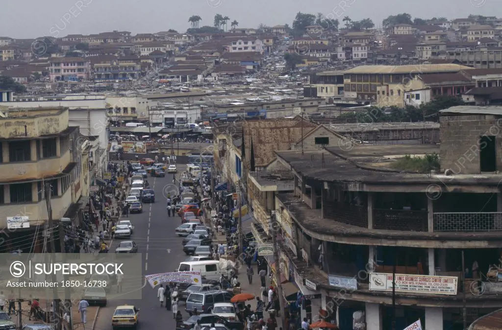 Ghana, Ashanti Region, Kumasi, Cityscape And Busy Street Scene.